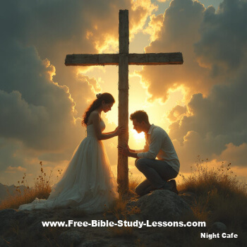 couple bowing at the cross