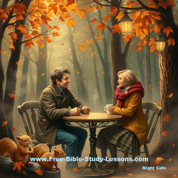 husband and wife sitting at a table in a autumn setting